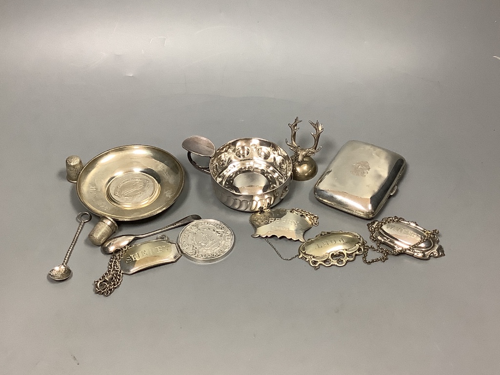 A group of small small silver, including cigarette case, small dish, wine label and two thimbles